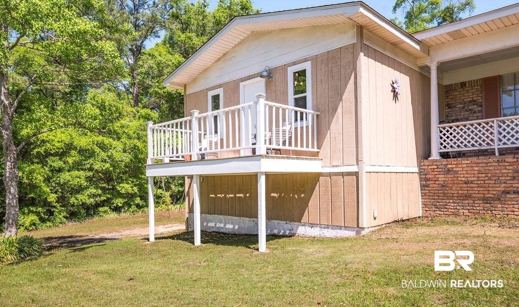 11901 Old Moffat Road Wilmer, AL 36587 - Photo 35 of 39 Wooden deck featuring a lawn