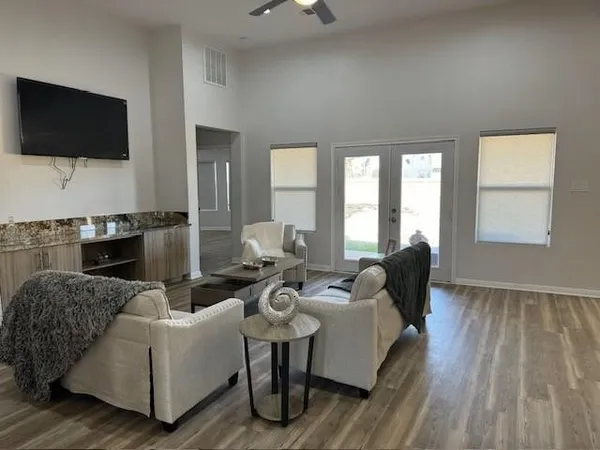 a living room with furniture and a flat screen tv