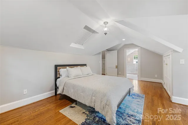 a bathroom with a granite countertop sink a mirror and a shower