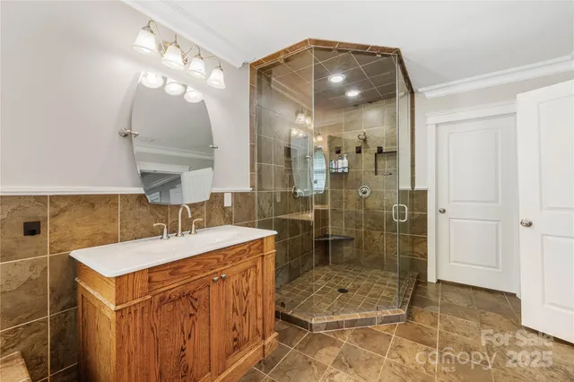 a bedroom with furniture and a book shelf
