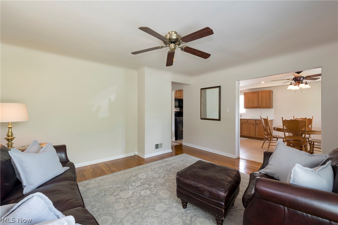 13175 McCracken Road Cleveland, OH 44125 - Photo 5 of 48 Living room featuring ceiling fan and light hardwood floors