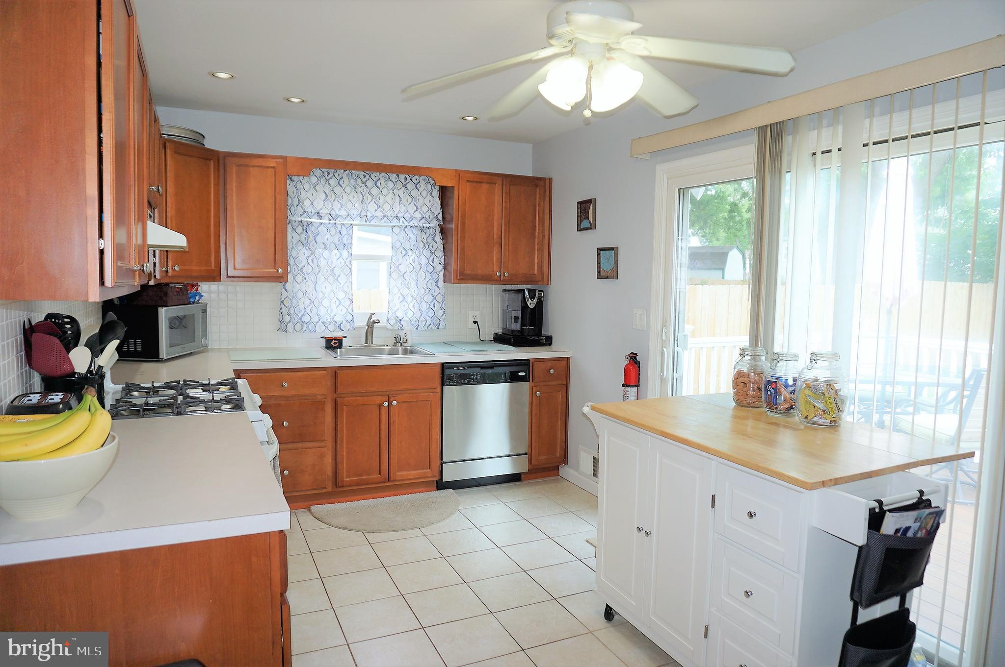 4394 Nottingham Way Hamilton, NJ 08690 - Photo 8 of 28 Kitchen with sliders out to back deck
