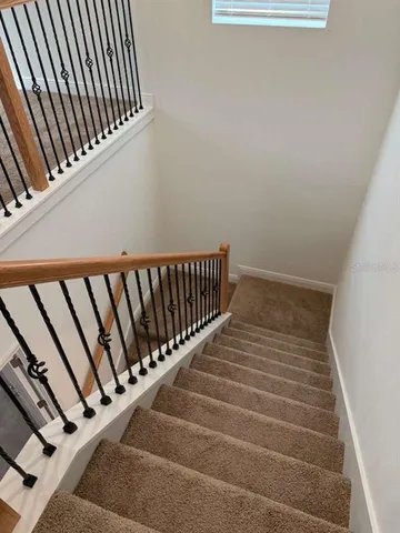 a view of a hallway with a door