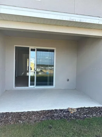 a view of room that has white cabinets