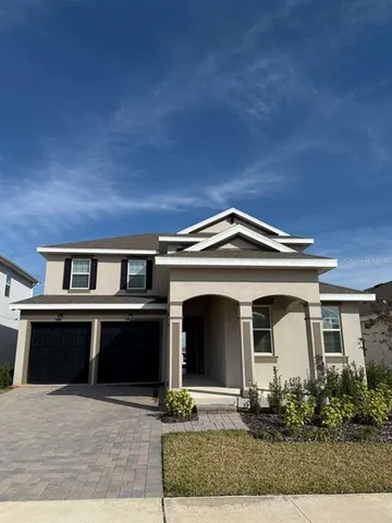 a front view of a house with yard