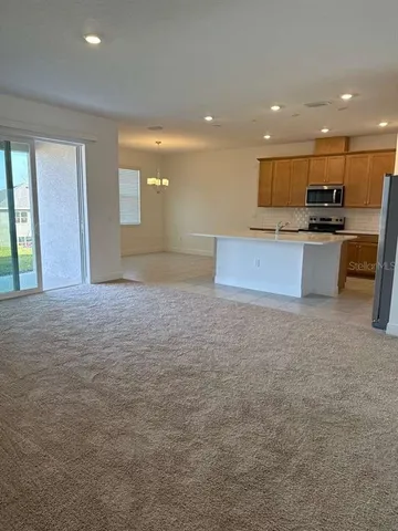 a view of kitchen with stainless steel appliances kitchen island