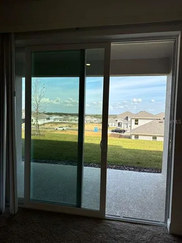 a kitchen with stainless steel appliances a microwave a sink and a refrigerator