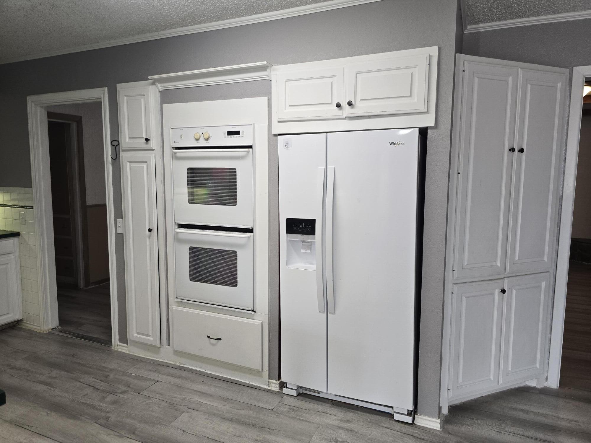506 North 19th Street Lamesa, TX 79331 - Photo 8 of 29 a view of kitchen with stainless steel appliances wooden floor and cabinet