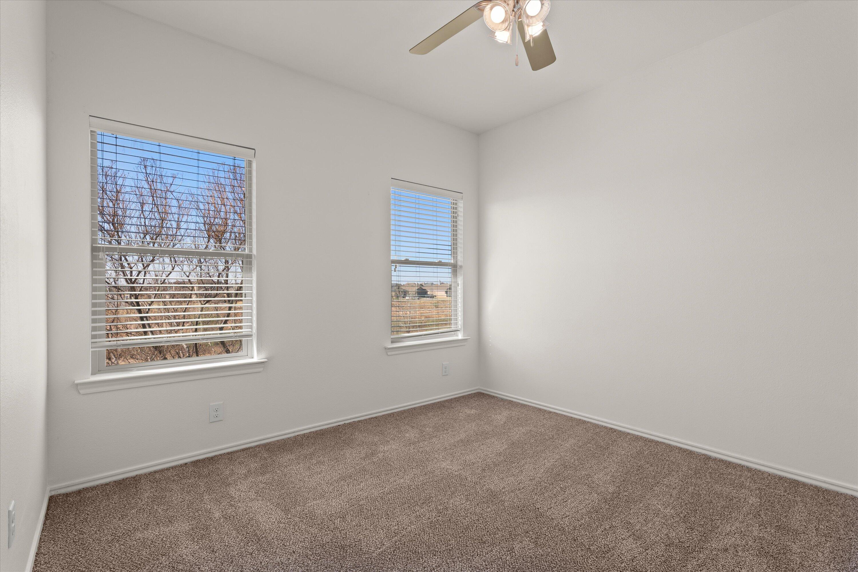 6908 21st Street Lubbock, TX 79407 - Photo 20 of 28 a view of an empty room with a window