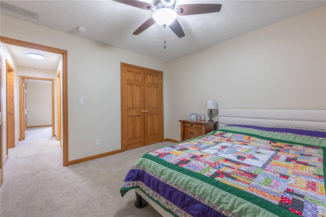 2645 Vance Road St. Paris, OH 43072 - Photo 21 of 35 This restful bedroom features plush carpeting and a convenient ceiling fan for ultimate comfort.