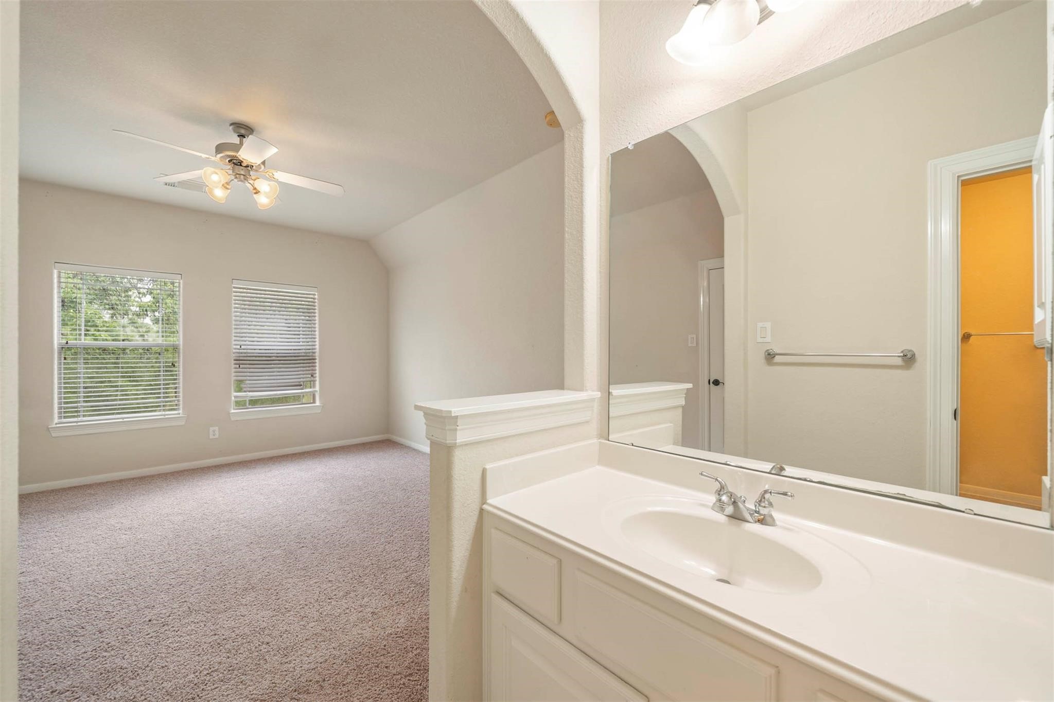 3 Etude Court Spring, TX 77382 - Photo 33 of 45 a bathroom with a sink and a mirror