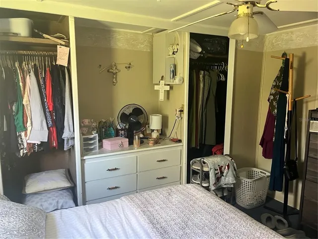 a room with a bed and a mirror