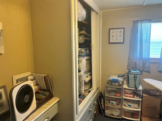 a view of storage and utility room with washer and dryer