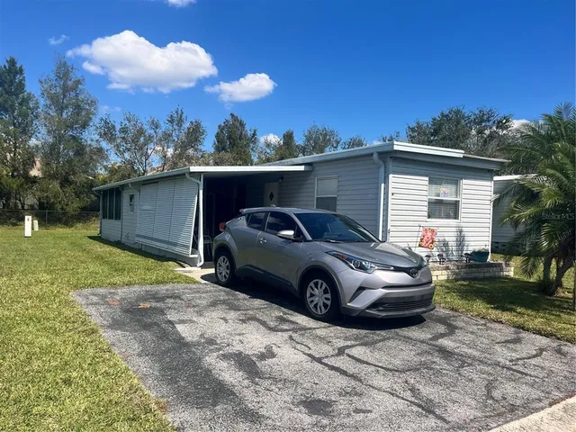 a car parked in front of a house
