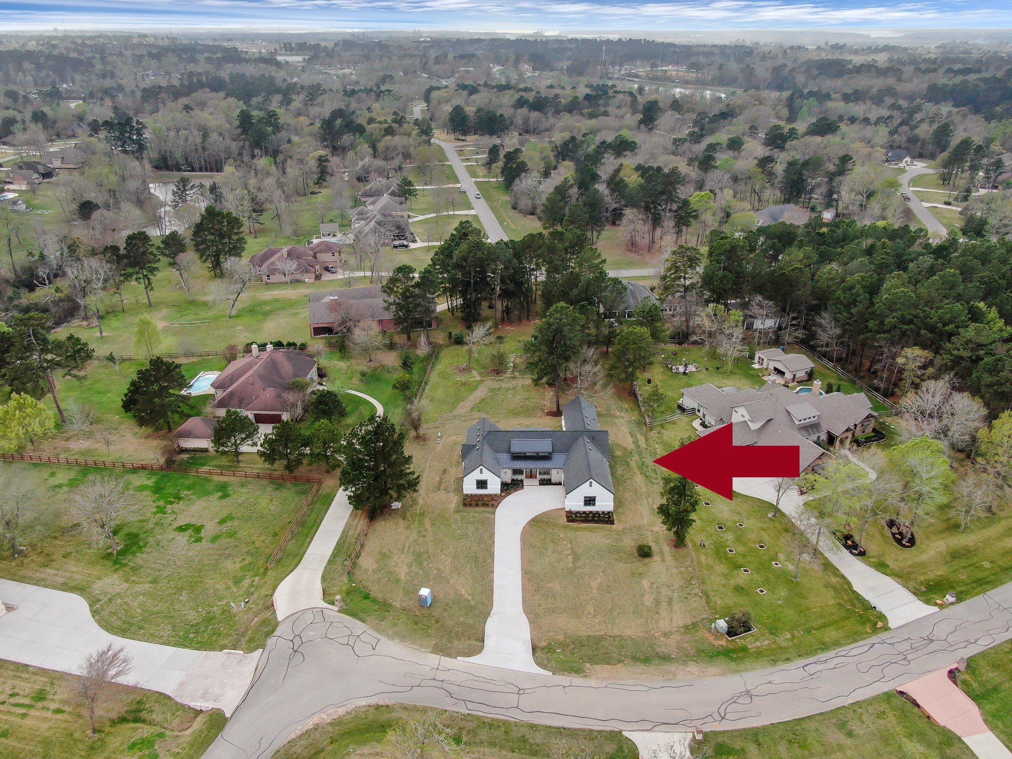 14742 Turquoise Trail Willis, TX 77378 - Photo 46 of 48 Wide aerial view showing the beautiful acreage community with large homesites, mature trees, and peaceful surroundings.