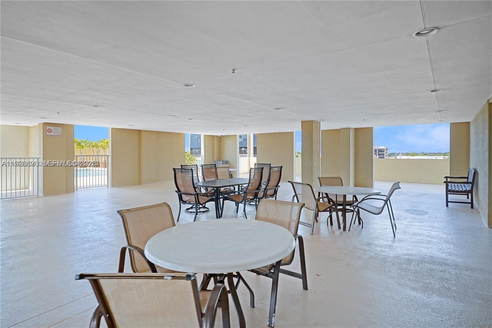 117 Northwest 42nd Avenue, Unit 1516 Miami, FL 33126 - Photo 20 of 76 a view of a dining room with furniture and wooden floor