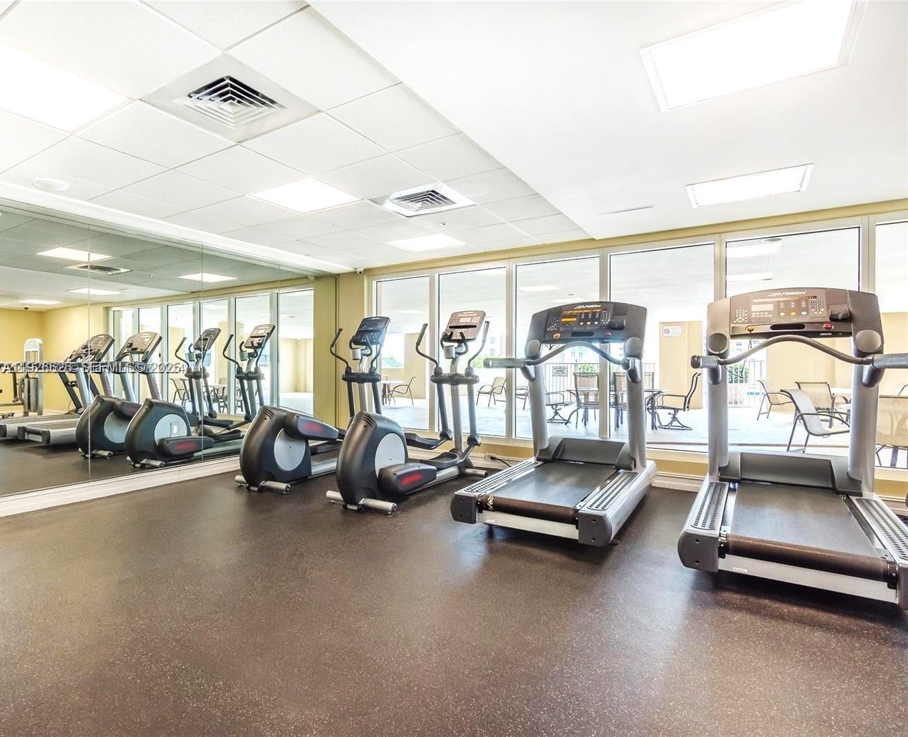 117 Northwest 42nd Avenue, Unit 1516 Miami, FL 33126 - Photo 21 of 76 a view of a room with gym equipment