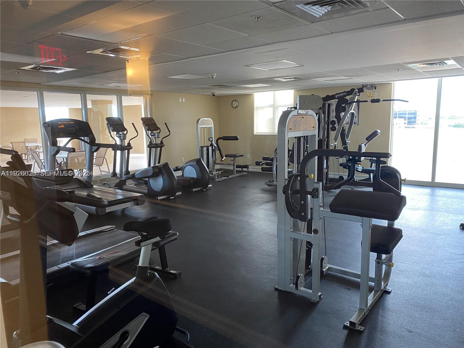 117 Northwest 42nd Avenue, Unit 1516 Miami, FL 33126 - Photo 23 of 76 a view of a room with gym equipment