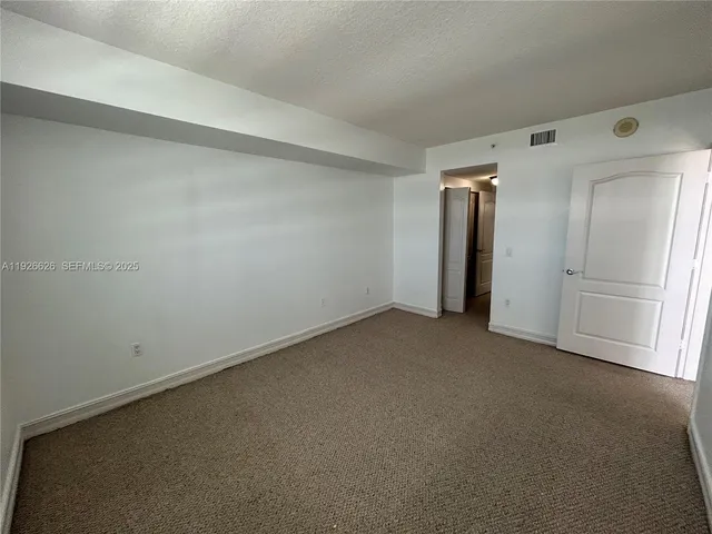 a view of a swimming pool and sitting area