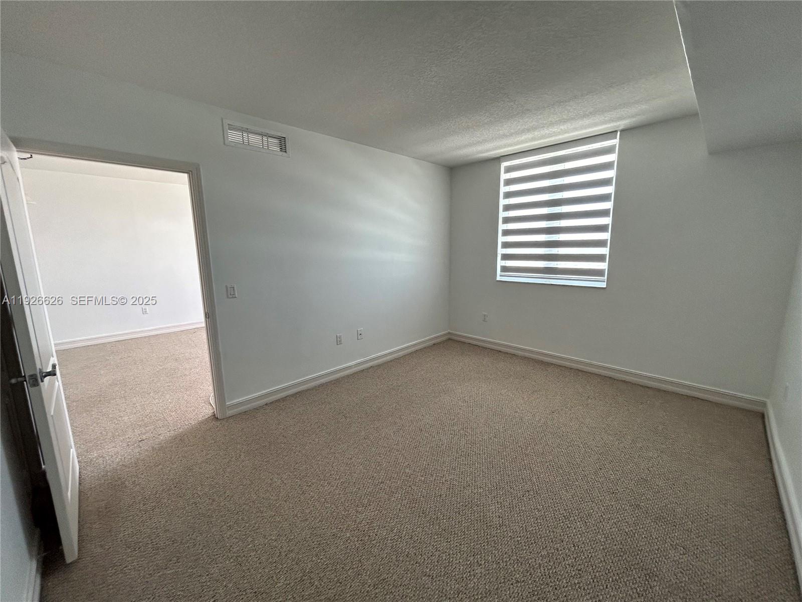 117 Northwest 42nd Avenue, Unit 1516 Miami, FL 33126 - Photo 38 of 76 a view of an empty room with a window