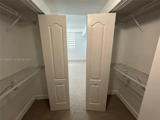 a kitchen with a refrigerator and a stove