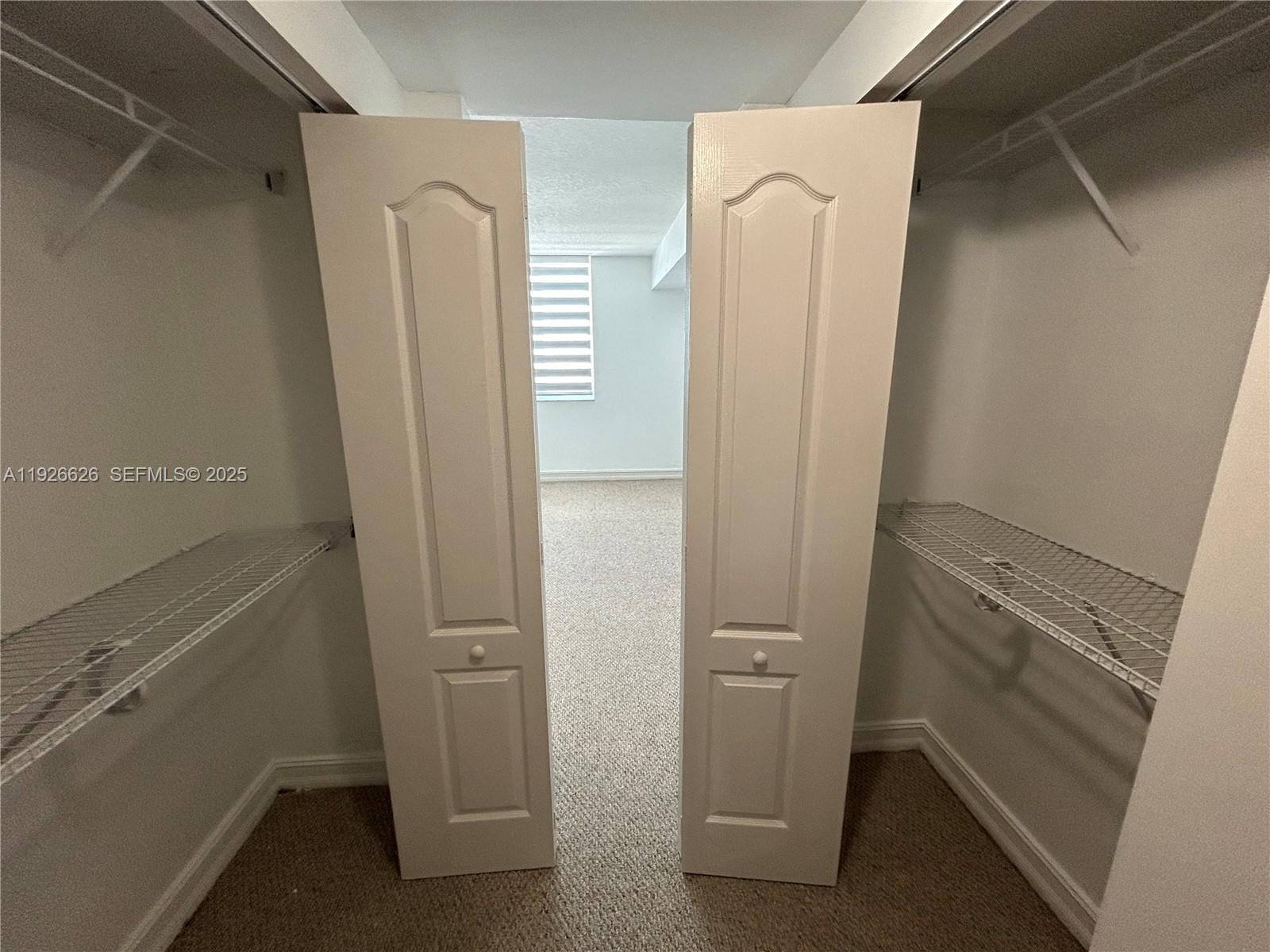 117 Northwest 42nd Avenue, Unit 1516 Miami, FL 33126 - Photo 39 of 76 a bathroom with a glass door shower