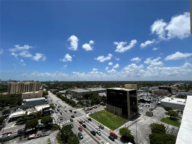 a painting on a wall next to a white cabinet