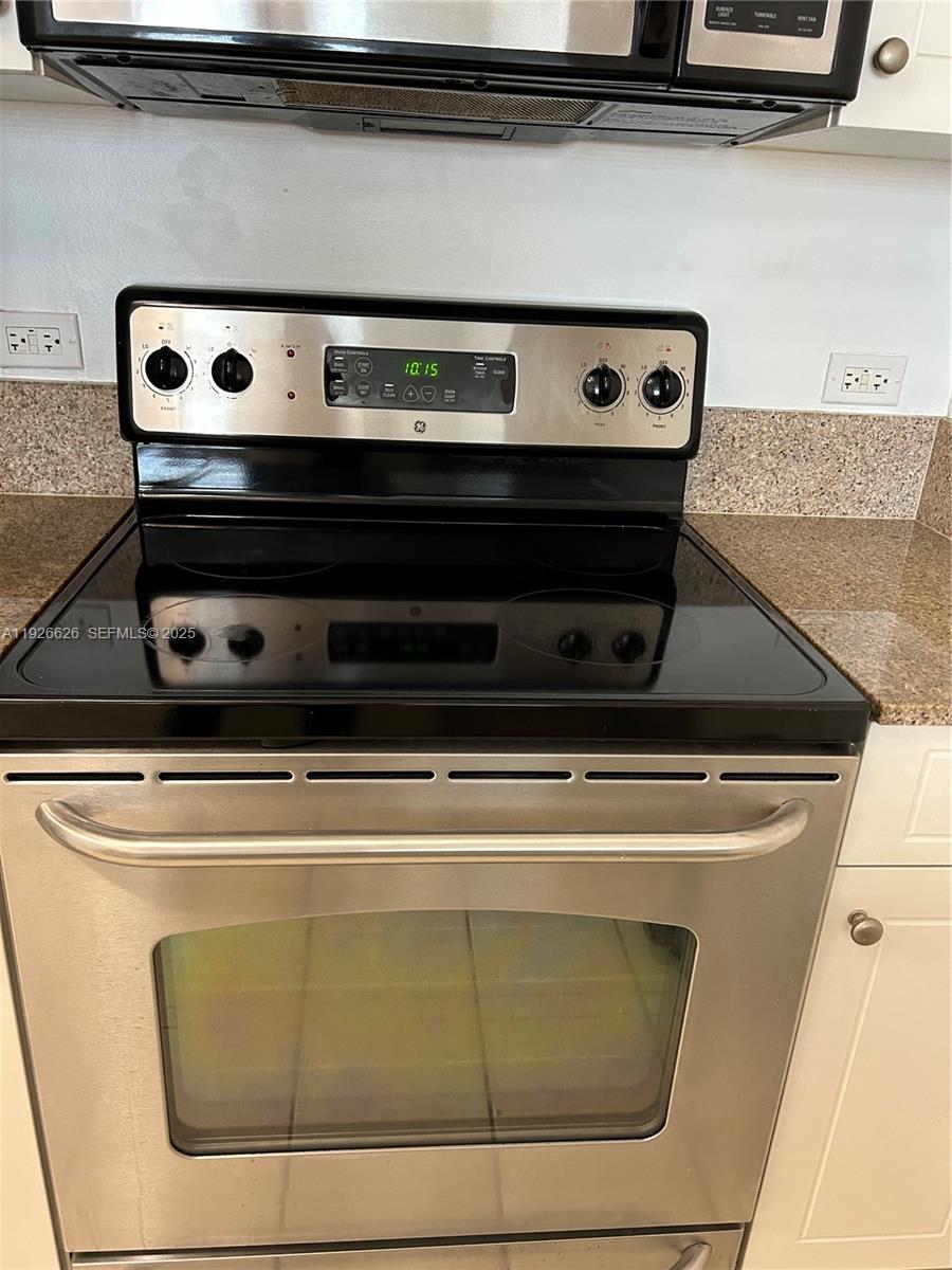 117 Northwest 42nd Avenue, Unit 1516 Miami, FL 33126 - Photo 55 of 76 a close view of stove top oven