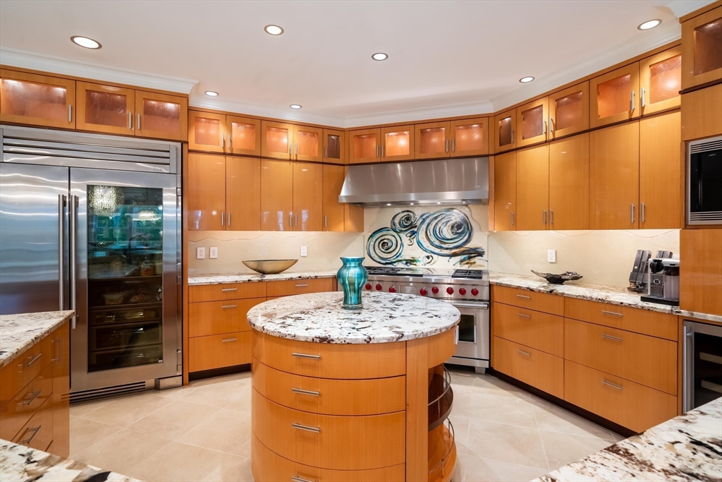 16 Meriam Street Lexington, MA 02420 - Photo 12 of 42 a kitchen with stainless steel appliances granite countertop a sink and a cabinets