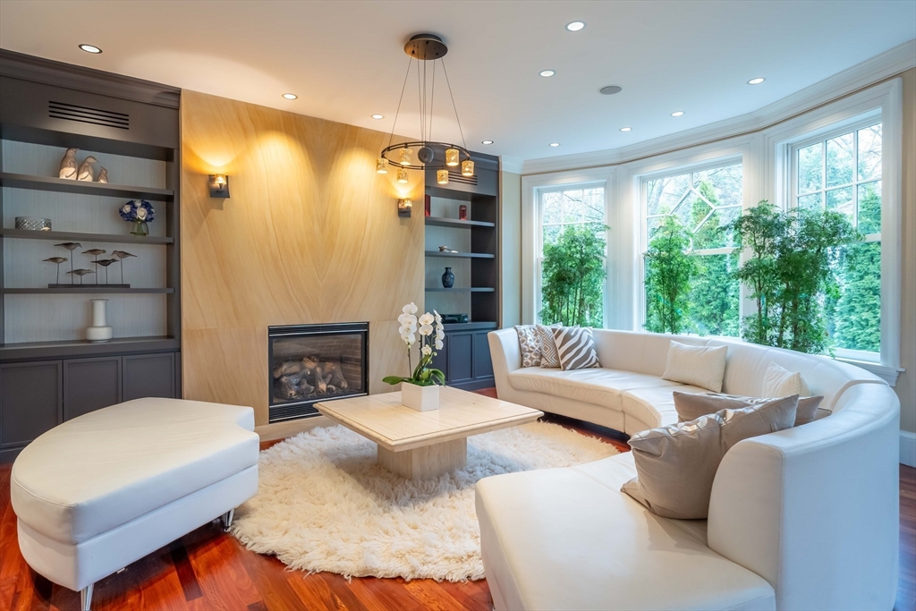 16 Meriam Street Lexington, MA 02420 - Photo 15 of 42 a living room with furniture lamp and a large window