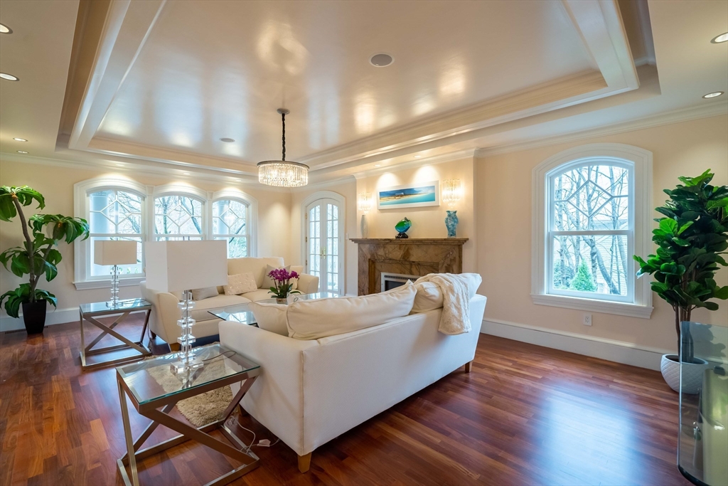 16 Meriam Street Lexington, MA 02420 - Photo 5 of 42 a living room with furniture and a chandelier