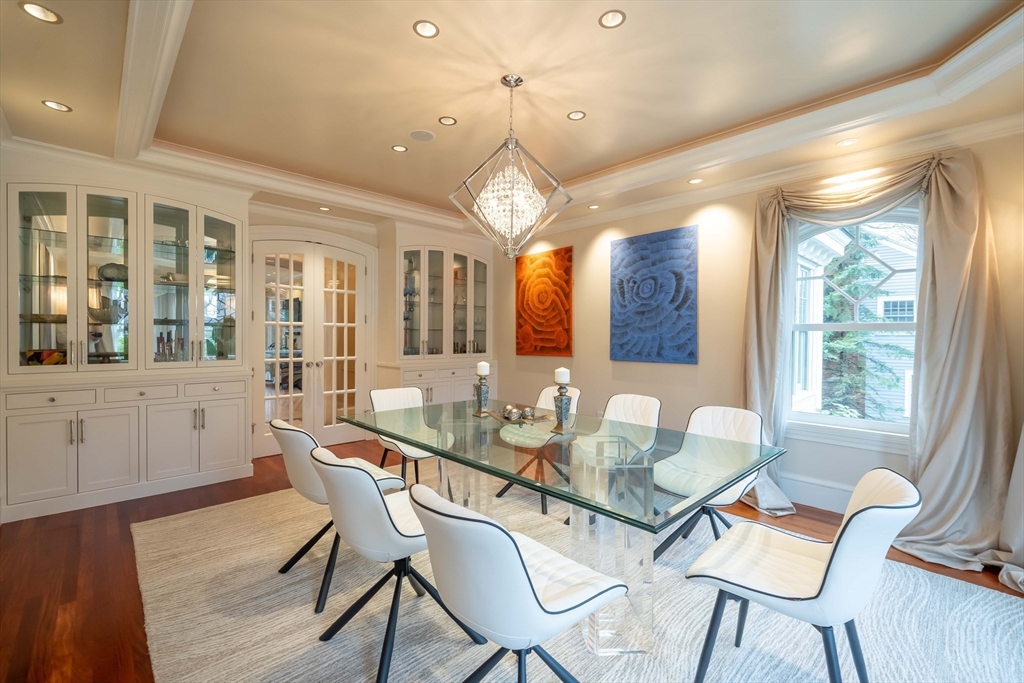 16 Meriam Street Lexington, MA 02420 - Photo 7 of 42 a dining room with furniture a chandelier and wooden floor