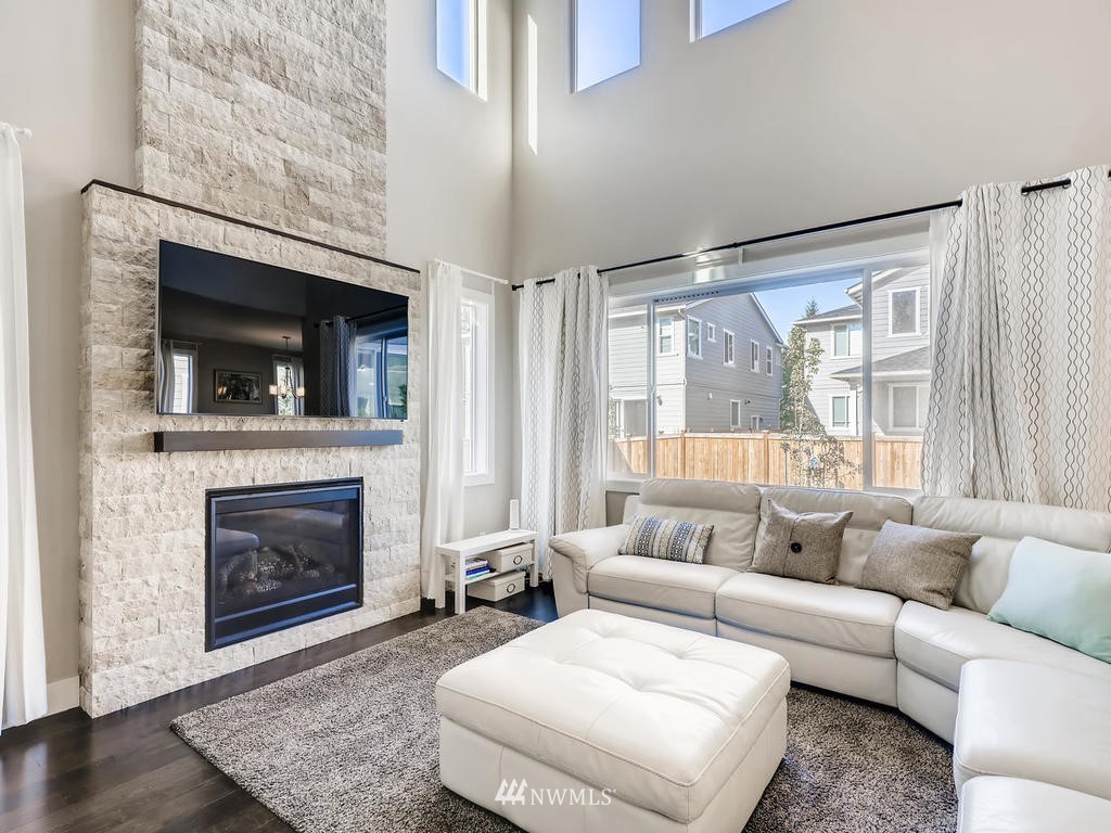 315 Graham Avenue Southeast Renton, WA 98059 - Photo 4 of 11 a living room with furniture and a fireplace