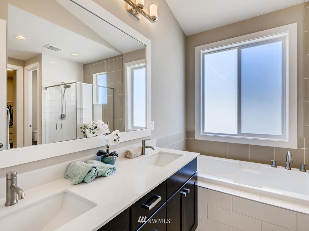 315 Graham Avenue Southeast Renton, WA 98059 - Photo 8 of 11 a bathroom with a bathtub and a sink
