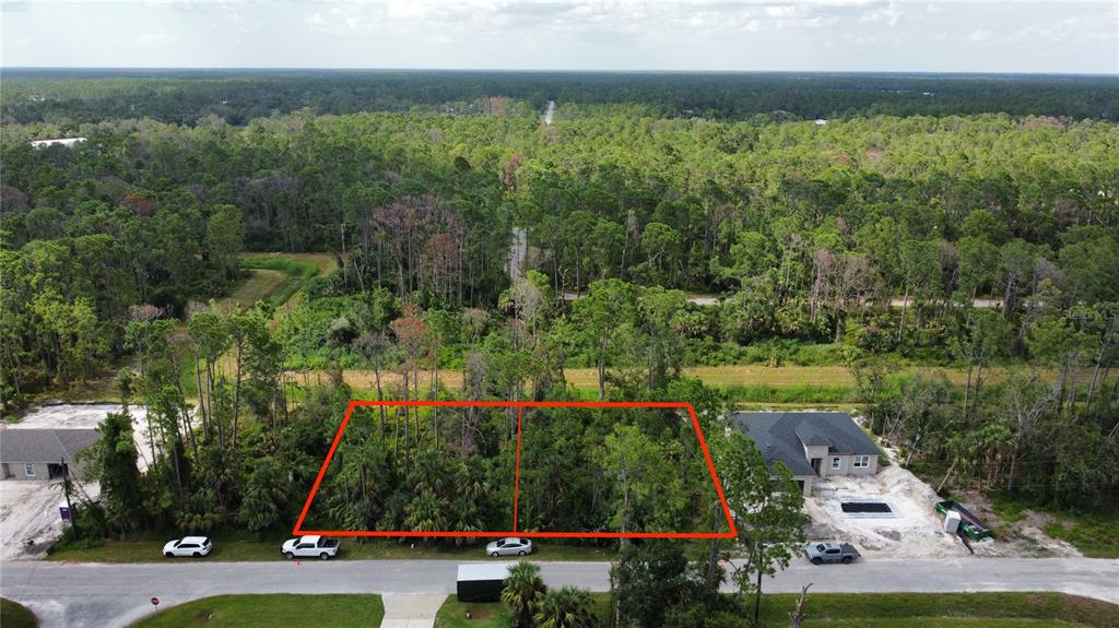 Armenia Rd Port North Port, FL 34286 - Photo 3 of 7 an aerial view of residential houses with outdoor space and trees