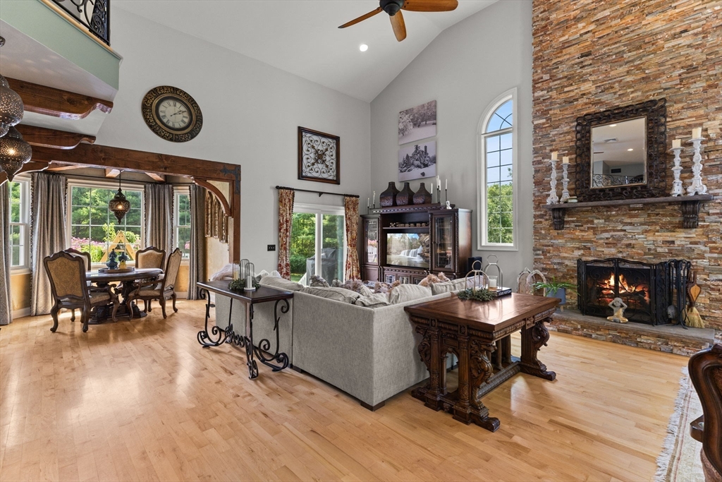 1276 Old Fall River Road Dartmouth, MA 02747 - Photo 12 of 42 a living room with furniture a fireplace and a large window