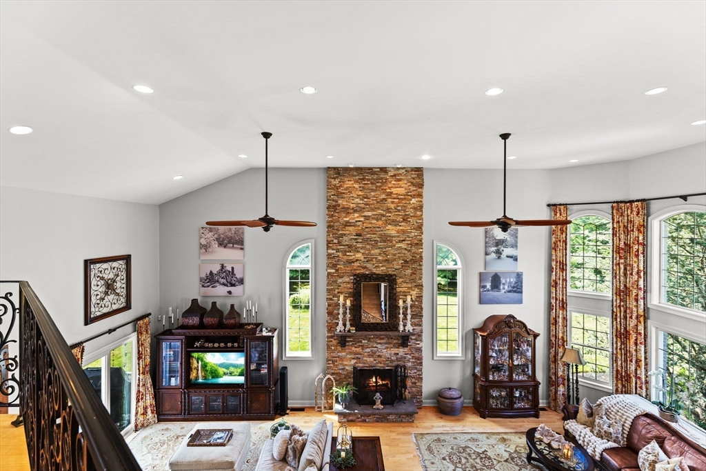 1276 Old Fall River Road Dartmouth, MA 02747 - Photo 16 of 42 a living room with furniture a flat screen tv and a fireplace