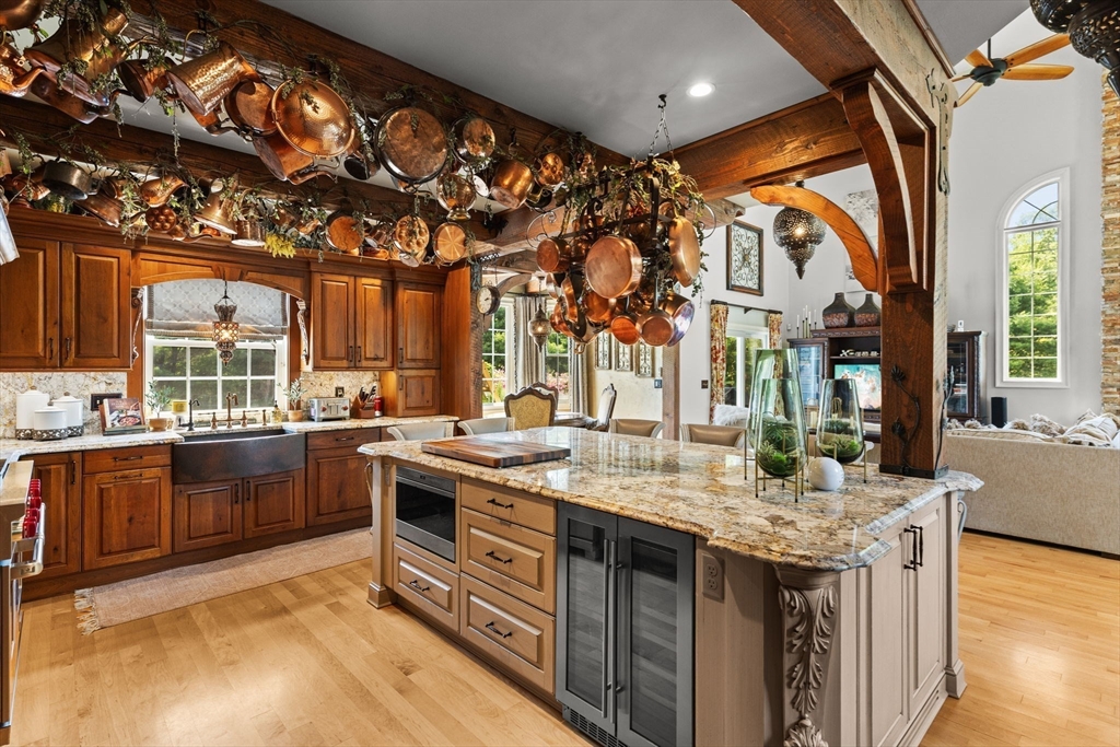 1276 Old Fall River Road Dartmouth, MA 02747 - Photo 21 of 42 a kitchen with stainless steel appliances granite countertop a stove and a sink