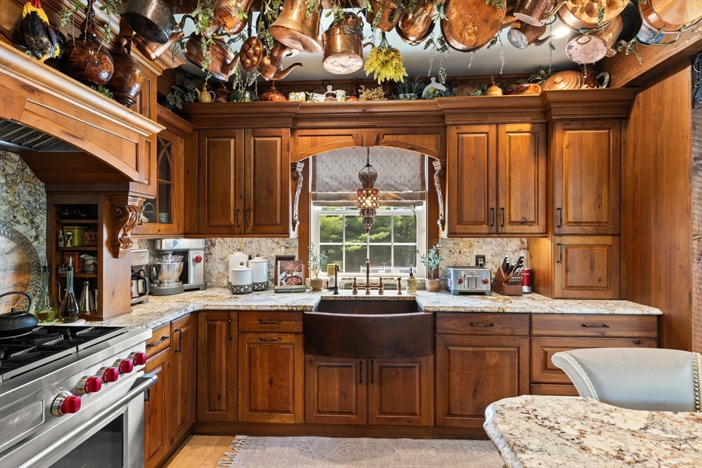 1276 Old Fall River Road Dartmouth, MA 02747 - Photo 22 of 42 a kitchen with a sink a stove and cabinets