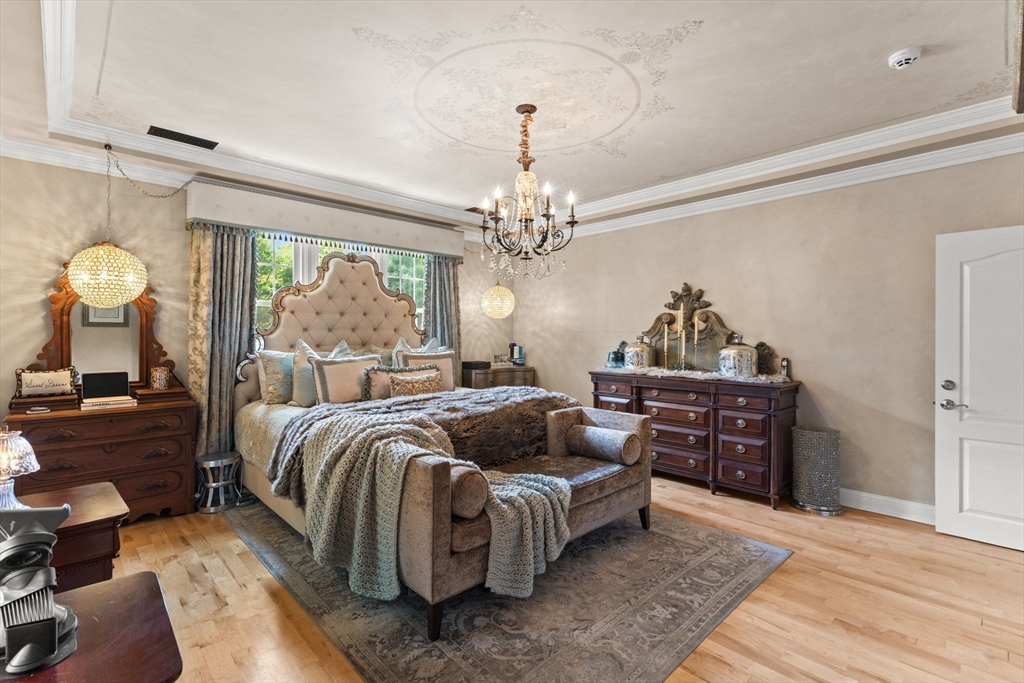 1276 Old Fall River Road Dartmouth, MA 02747 - Photo 23 of 42 a bedroom with bed and a chandelier