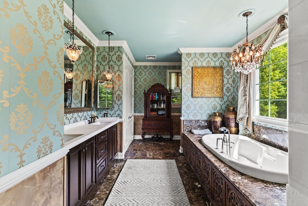 1276 Old Fall River Road Dartmouth, MA 02747 - Photo 27 of 42 a bathroom with a sink mirror and a bathtub