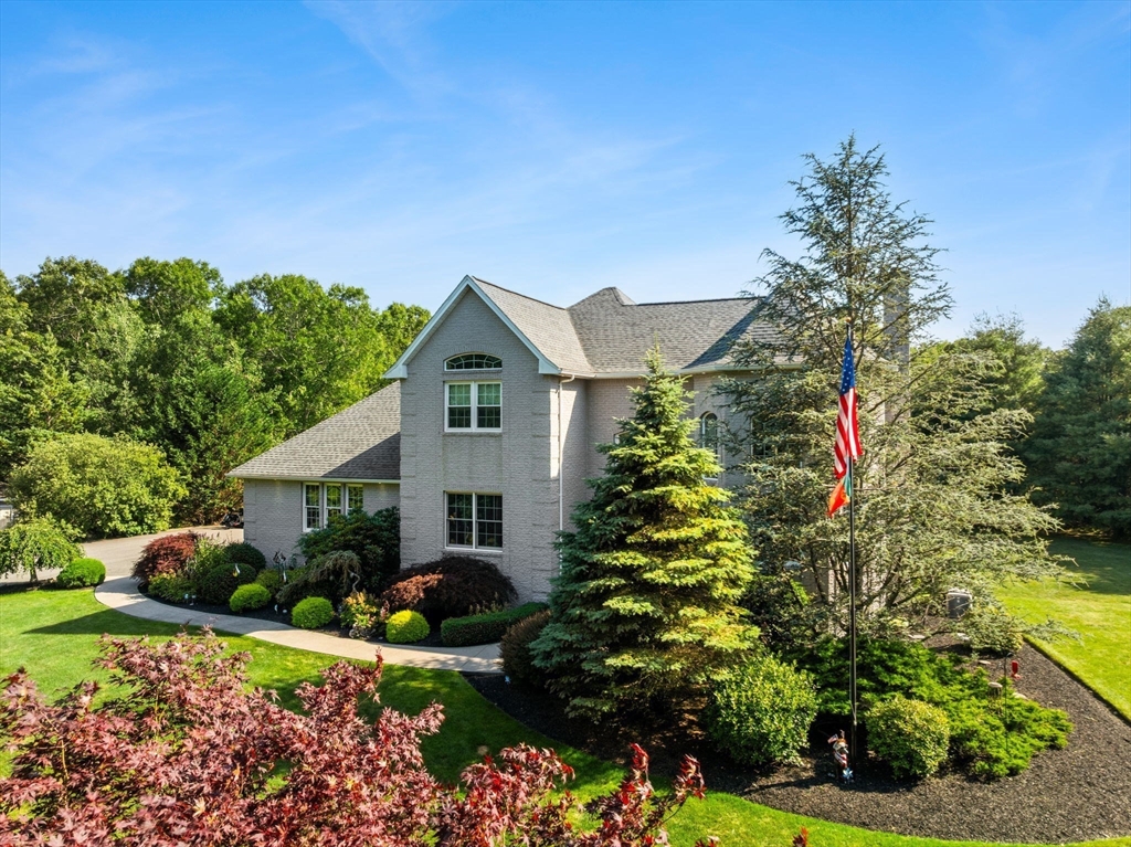 1276 Old Fall River Road Dartmouth, MA 02747 - Photo 3 of 42 a front view of a house with a yard