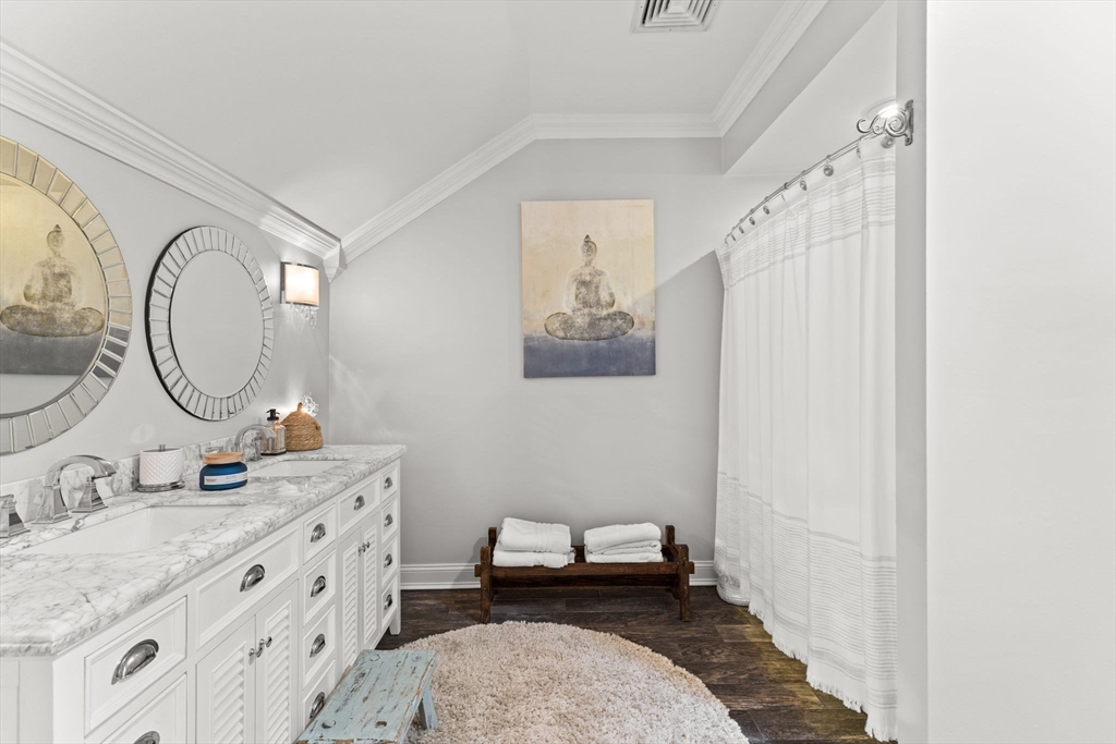 1276 Old Fall River Road Dartmouth, MA 02747 - Photo 32 of 42 a spacious bathroom with a granite countertop sink a mirror and shower