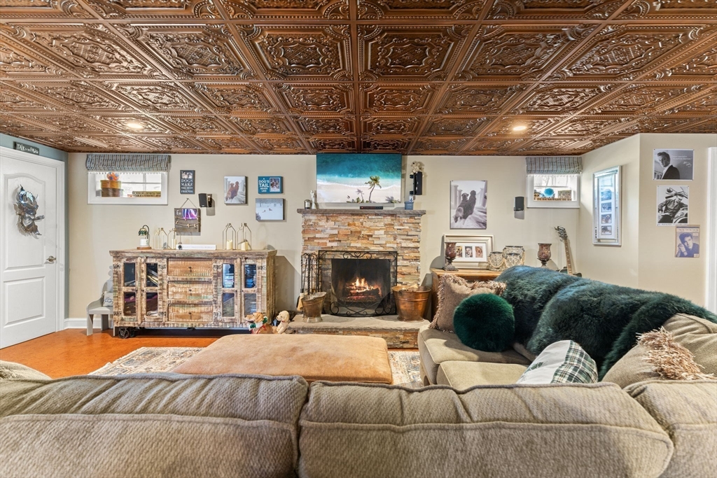 1276 Old Fall River Road Dartmouth, MA 02747 - Photo 34 of 42 a living room with furniture and a fireplace