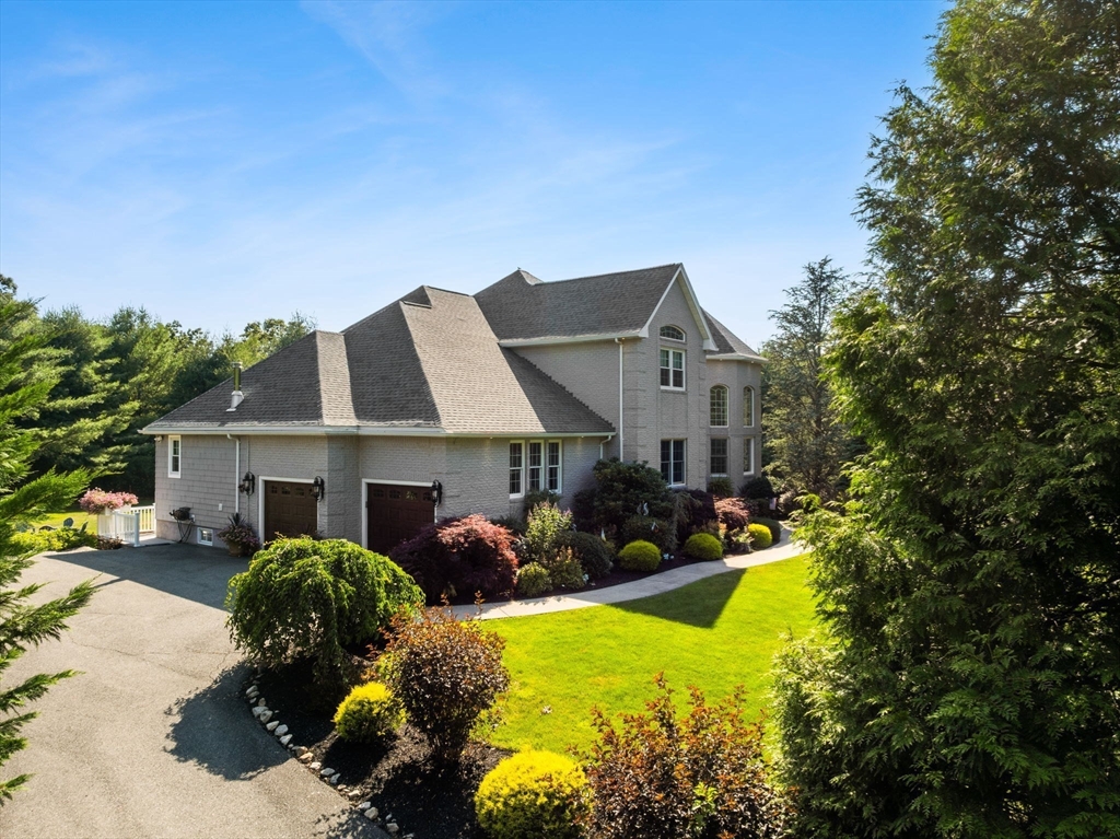 1276 Old Fall River Road Dartmouth, MA 02747 - Photo 4 of 42 a front view of a house with swimming pool and porch