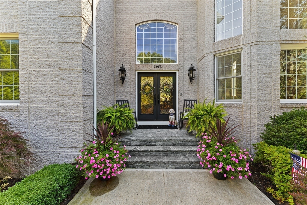 1276 Old Fall River Road Dartmouth, MA 02747 - Photo 5 of 42 a front view of a house with a garden