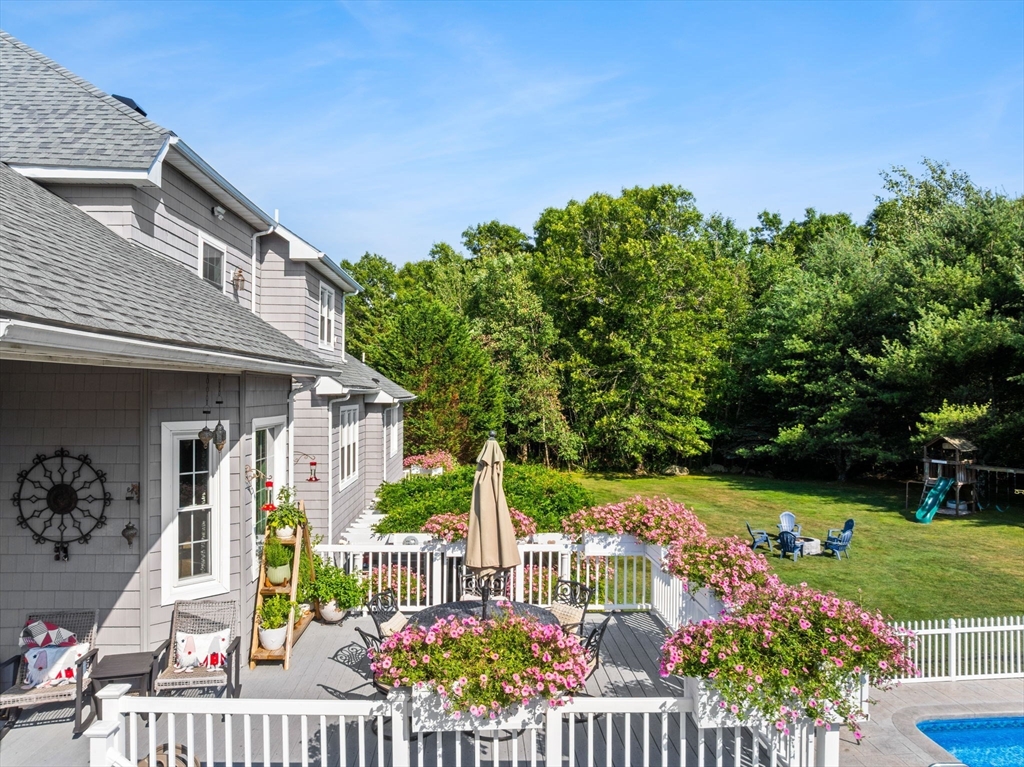 1276 Old Fall River Road Dartmouth, MA 02747 - Photo 7 of 42 a view of a house with wooden fence and garden