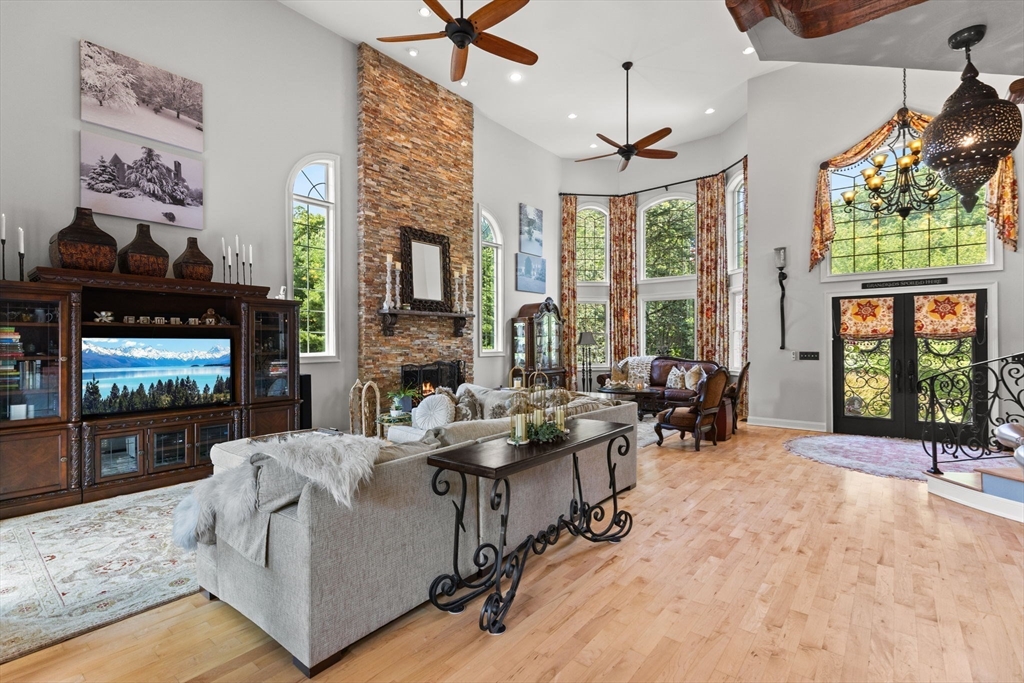 1276 Old Fall River Road Dartmouth, MA 02747 - Photo 10 of 42 a living room with fireplace furniture and a large window