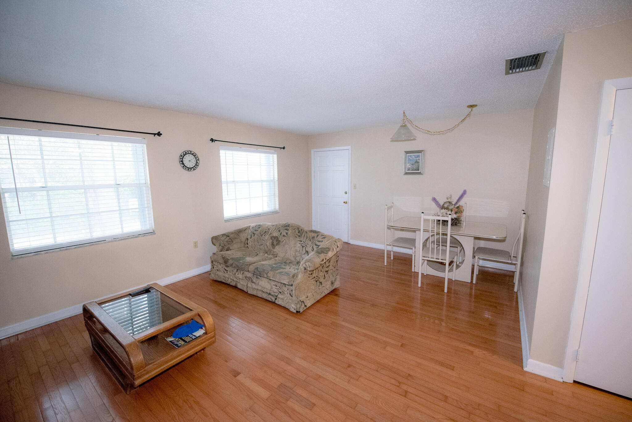 40 High Point Road, Unit F205 Tavernier, FL 33070 - Photo 5 of 14 a living room with furniture and a wooden floor