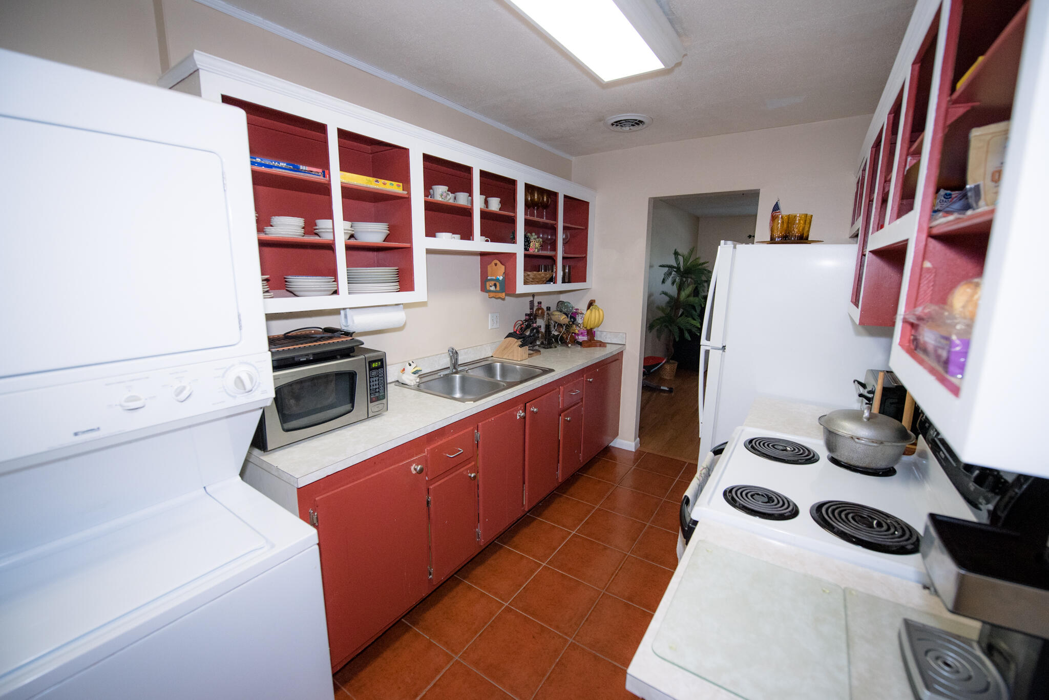 40 High Point Road, Unit F205 Tavernier, FL 33070 - Photo 8 of 14 a kitchen with stainless steel appliances a stove a sink and a refrigerator
